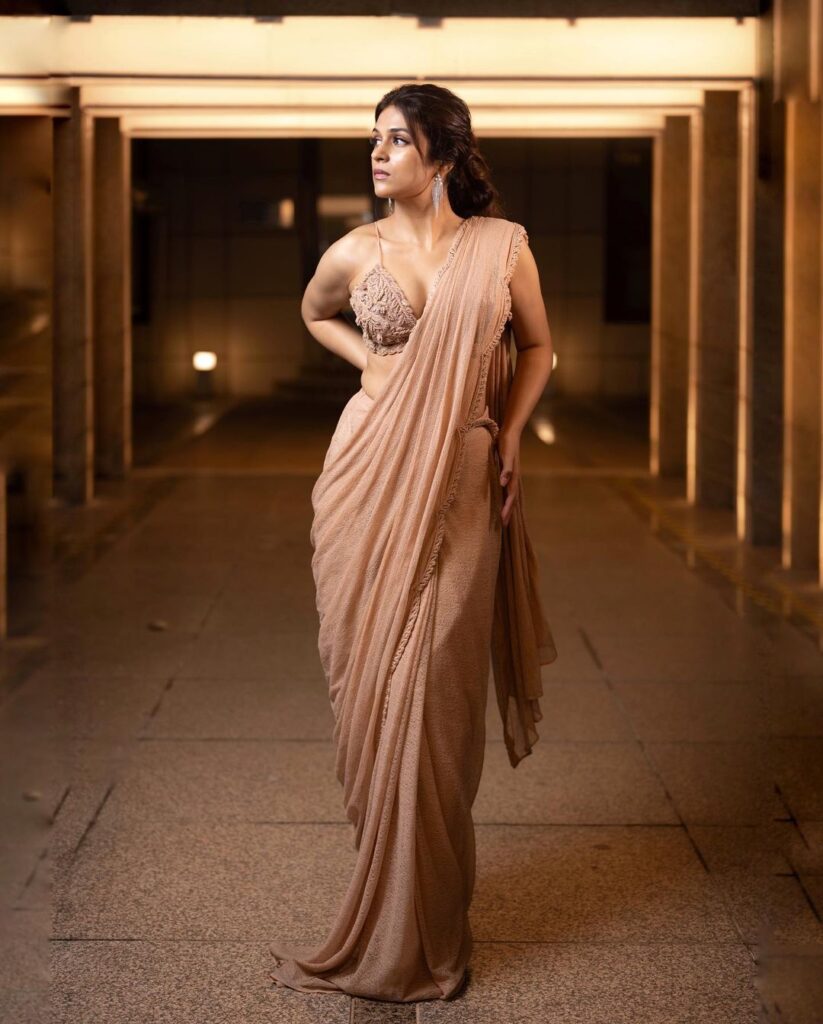 Captivating poses: Shraddha Das strikes a pose in a vibrant saree for her recent photoshoot