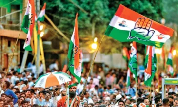 A Congress Party Rally With Workers Waving Party Flags