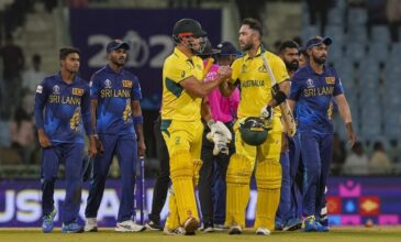 Australian Batsmen shake hands after victory with SL Team in background