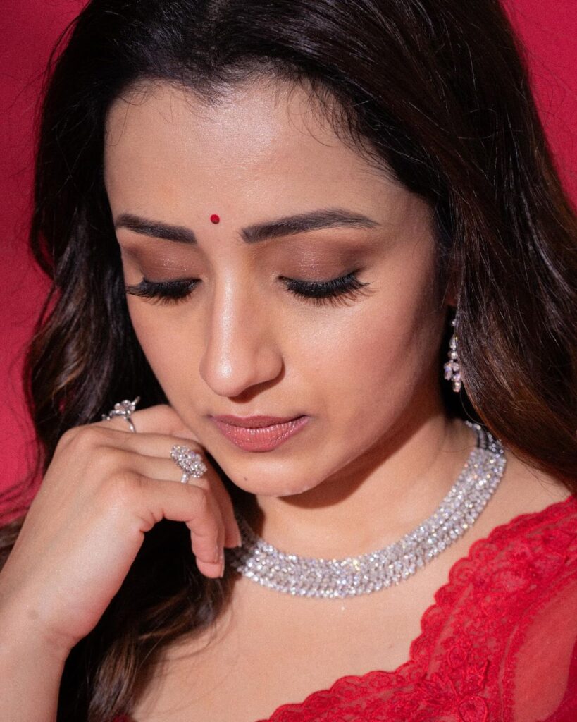 Trisha's photoshoot showcases her in a mesmerizing traditional attire, radiating grace and charm