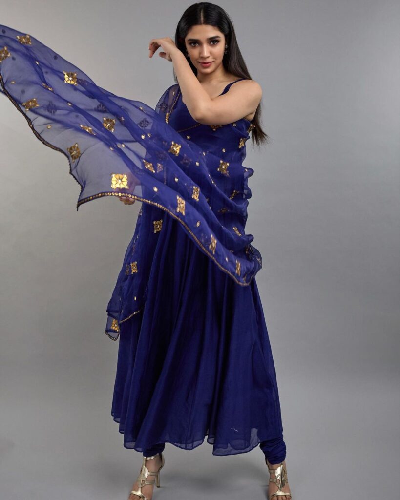 Krithi Shetty shines in traditional blue attire.