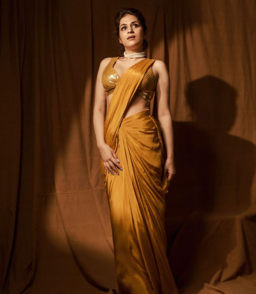 Actress Shraddha Das in a captivating yellow saree