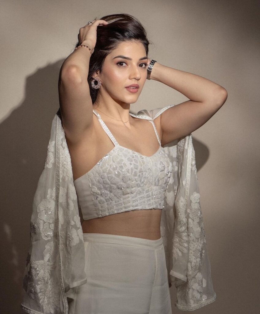 Mehreen Pirzada captivates in an ethereal white outfit, a vision of purity.