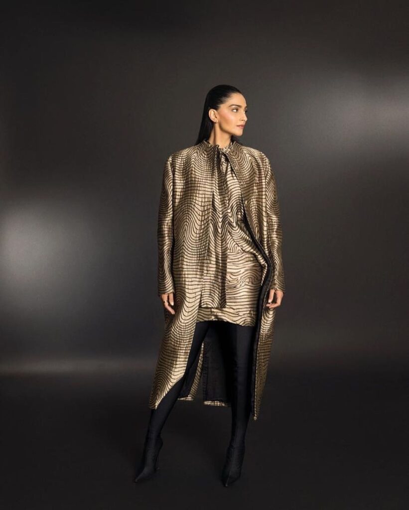 Sonam Kapoor radiates elegance in a shimmering gold coat and pants