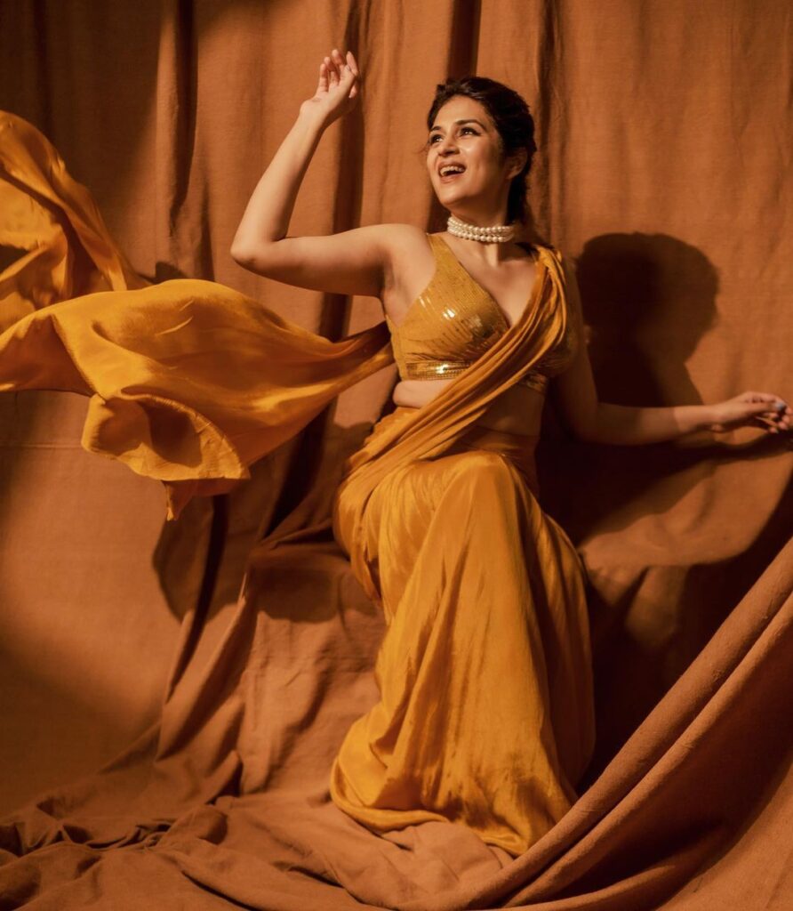 Actress Shraddha Das stuns in a radiant yellow saree