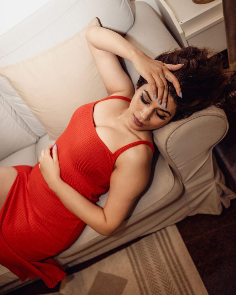 Shraddha Das captivates in a gorgeous red dress, showcasing timeless beauty.