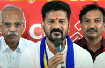 Revanth Reddy speaking on stage with CPI leaders in the background.