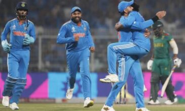 Ravindra Jadeja celebrates a wicket with Indian teammates.