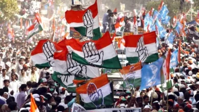 Congress Flags being waved in a party rally.