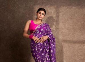 Hebah Patel embraces beauty in a purple saree.