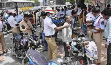 Telangana traffic police stop motorists for checking.