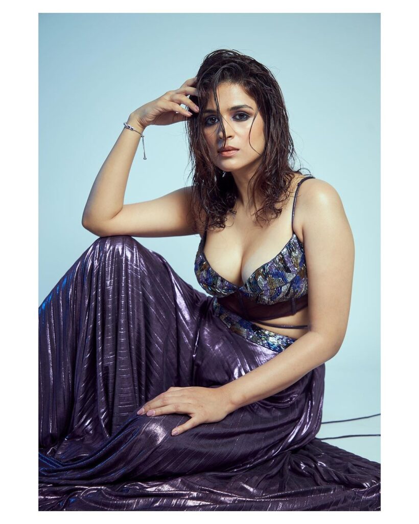 Shraddha Das donned a stunning ensemble featuring a radiant purple skirt and a matching top