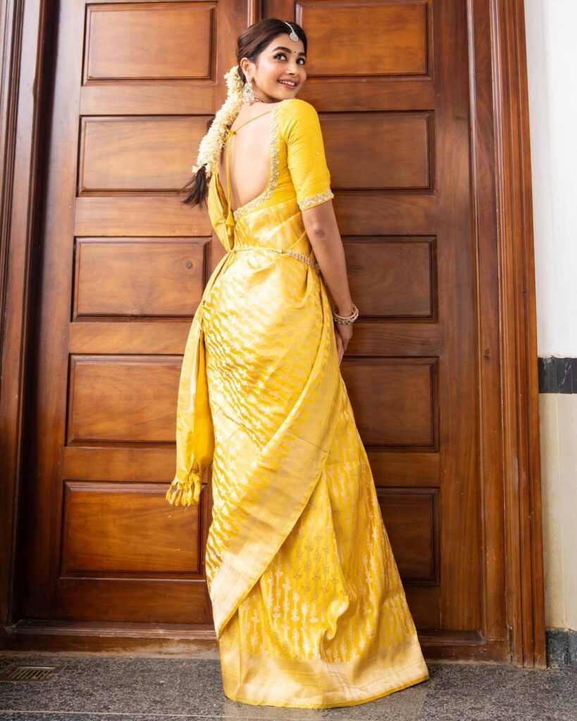 Pooja Hegde looks radiant in a yellow pattu saree