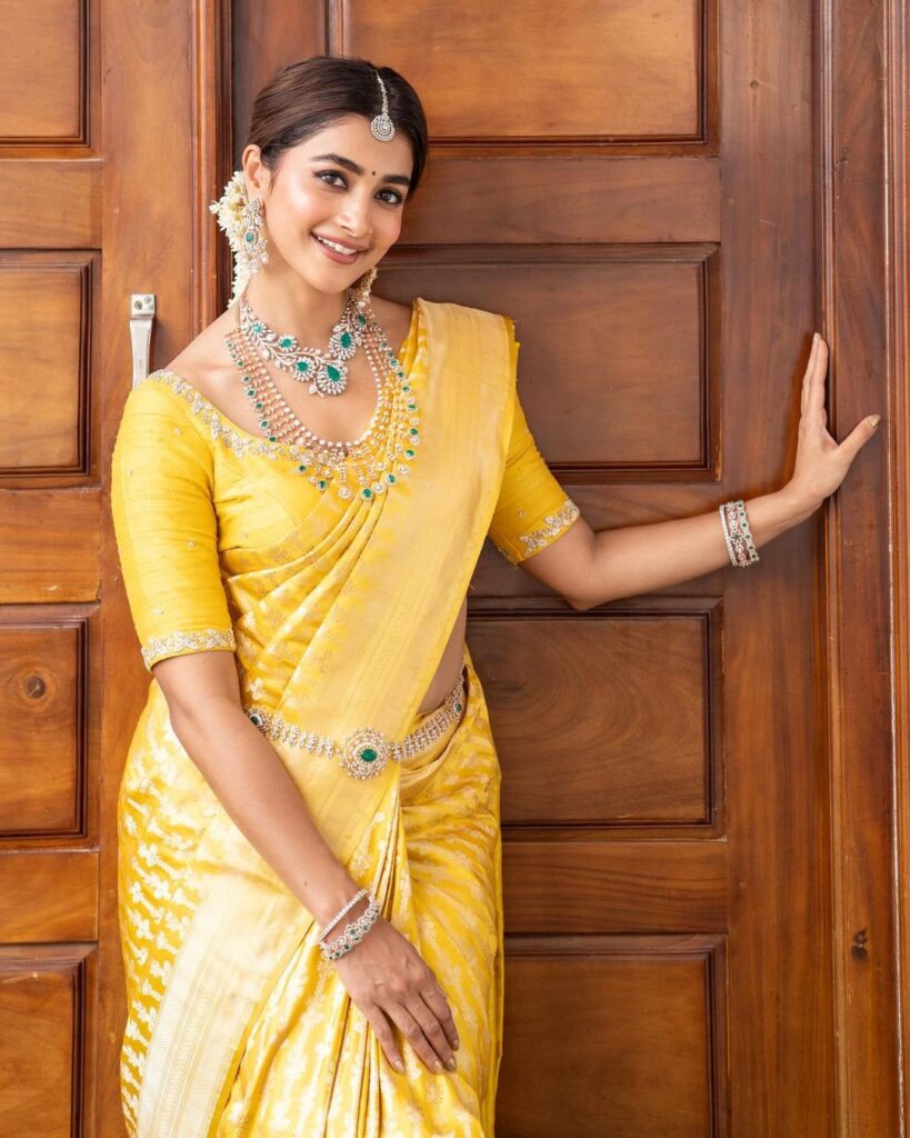 Pooja Hegde's traditional look features a yellow saree