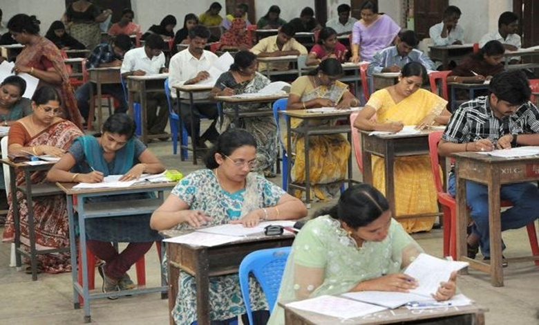 Indians writing job exams.