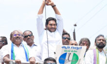 CM Jagan saluting the crowd in a roadshow, May 2024.