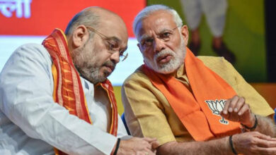 Amit Shah and Modi discussing.