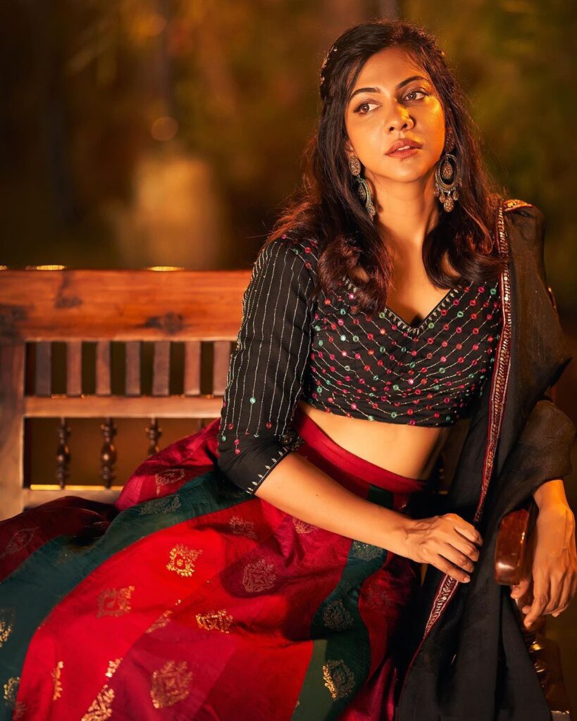 Elegance personified: Madonna Sebastian in a striking red and black photoshoot