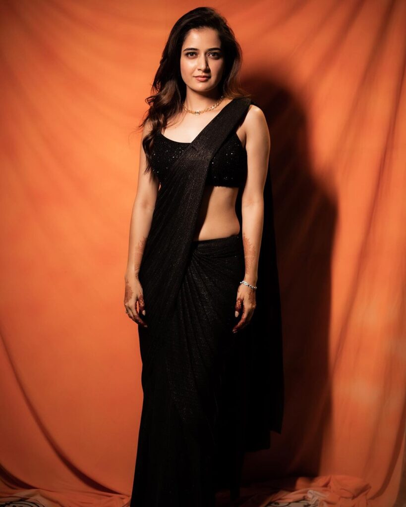Ashika exudes confidence in a striking black saree