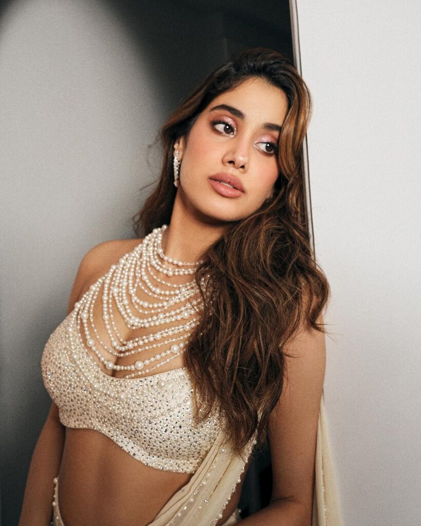 Janhvi Kapoor in a white saree with a plunging neckline and intricate beadwork