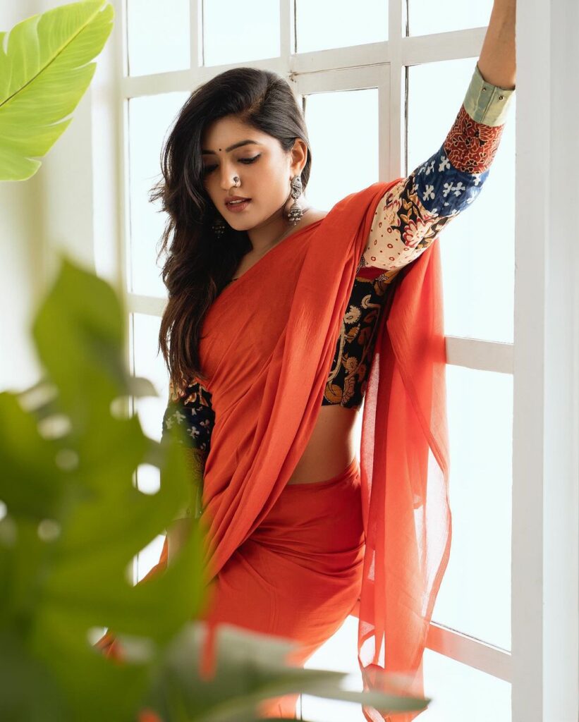 Eesha Rebba radiates beauty in orange saree and bangles