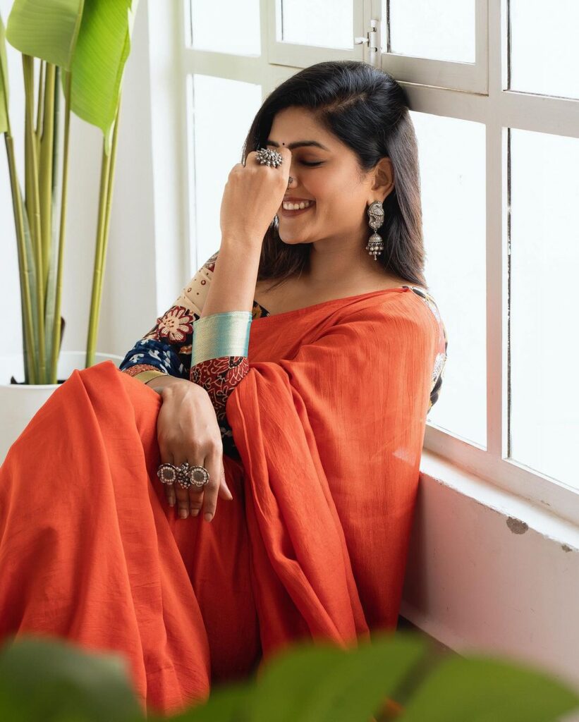 Eesha Rebba stuns in orange saree, kalamkari blouse smiling
