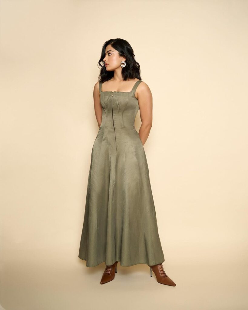Rashmika in green maxi dress & brown boots, chic & elegant