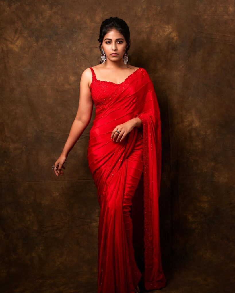Anjali stuns in a captivating red saree ensemble