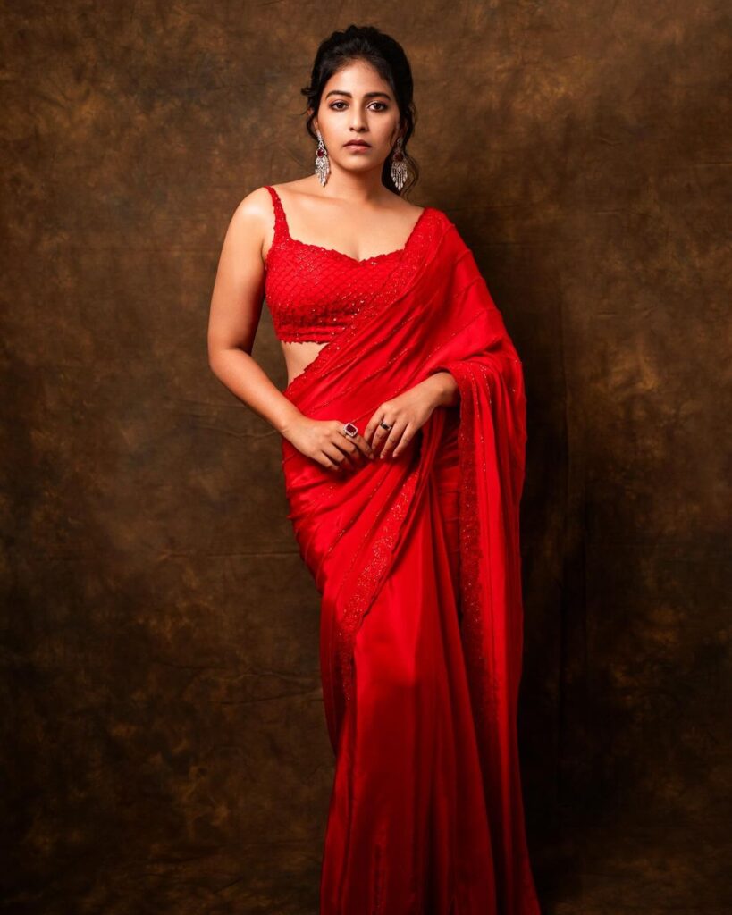 Anjali in red saree and sweetheart-neck blouse with chic ponytail
