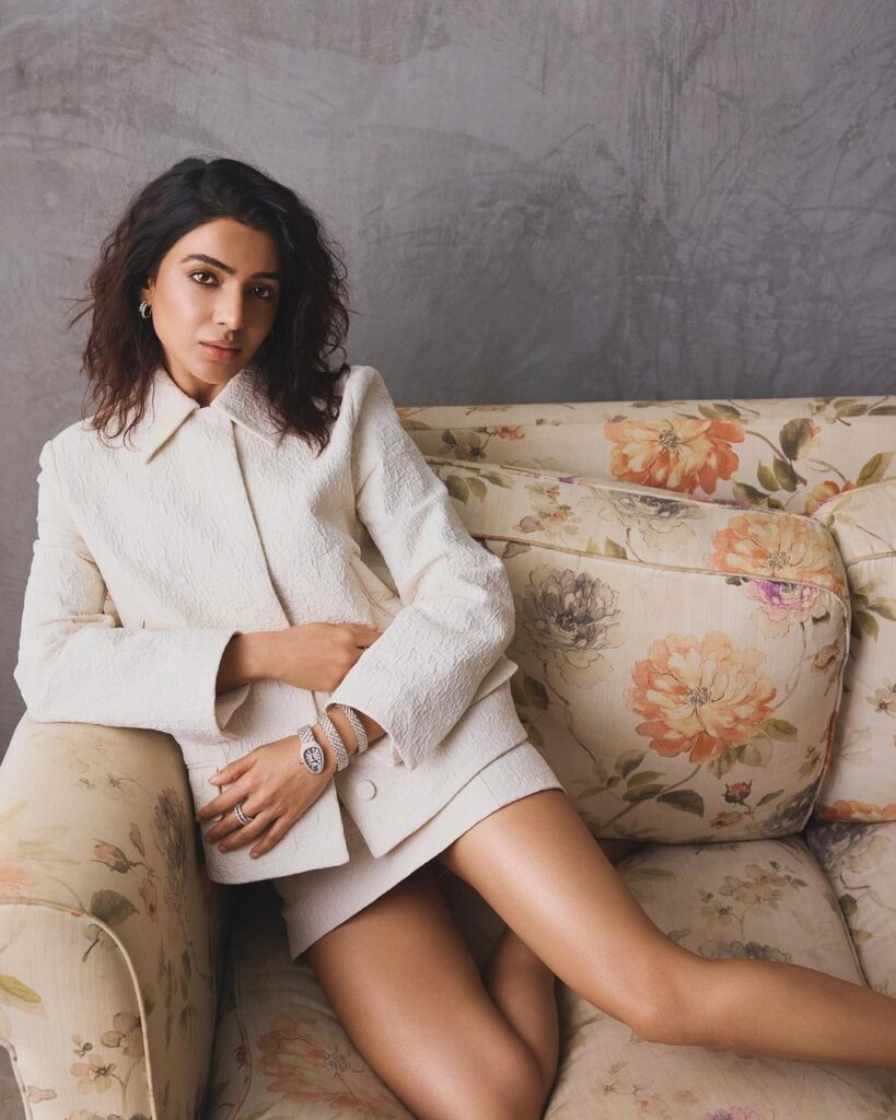 Samantha rocks white Gucci suit and shorts Sitting in a Couch