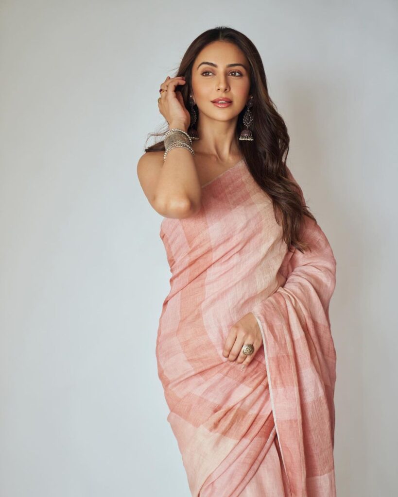 Rakul Preet Singh's chic hairstyle complements her vibrant saree ensemble